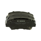 Front face of the shrink-wrapped pad stack showing BOSCH logo and part marking '0 986 AB3 106-HX6' with secondary code '07709 25X BNA140' and 'MADE IN TAIWAN' impressed on the backing plate.