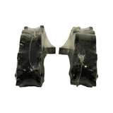 Edge-on view of both pads standing on their shoulders, showing the contoured profile of the backing plate and a wrinkled layer of clear protective shrink film