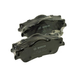 Close three-quarter view of both shrink-wrapped pads showing the friction-side chamfers, central noise-damping slot, and the embossed Bosch logo on each backing plate
