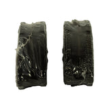 Edge-on profile view of two sealed brake pads showing the friction material thickness and plastic wrap integrity