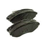 Alternative three-quarter view of both pads side by side with backing plate stampings legible through the plastic wrap