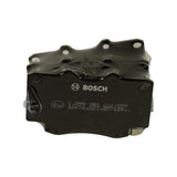 Top-down view of the shrink-wrapped pad set showing the backing plate of one pad with BOSCH logo, E11 approval, moulded markings 0 986 AB1 931-HX6, 17701 25X, BNA140 and 90R-02A01487/49771