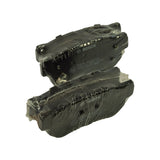 Angled stacked view of both pads, highlighting shaped ears and backing plate geometry