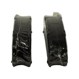 Side/edge profile of both pads on their friction face, showing full pad thickness, the raised backing-plate edges and moulded locator nubs on the side.