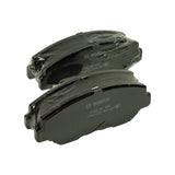 Three-quarter angle of two wrapped pads stacked, showing the abutment ears on the backing plate and one centrally slotted face