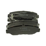 End-on view of pads showing the tabbed wear-indicator on the upper pad and the slot cut across the friction material of the lower pad