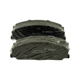 Two friction-material faces of shrink-wrapped pads, each showing moulded '0 986 AB4 647' and batch marking '17919 586 BNA143' with Bosch logo