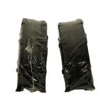 Edge profile of the two wrapped pad pairs showing backing-plate thickness and ears
