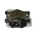 Two pads stacked face-to-face in their sealed bag, one pad showing the Bosch-logo-stamped steel backing plate with part number 0 986 TB 401 -HX6, batch code 03709, foundry marks 25X BNA140, and 'MADE IN TAIWAN'