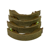 Stacked side-on view focusing on the friction-lining edges, showing chamfered ends, thickness of the linings and clean unworn surfaces