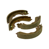 Top-down view with two shoes inverted to show steel-web side and two upright showing lining side, exposing both self-adjuster levers and lever tab detail