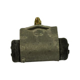 Rear face of the cylinder showing casting detail, no visible stamped markings, both end boots in place with central mounting boss