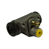 Opposite three-quarter angle revealing the piston bore through pulled-back boot, bleeder and brake line fitting protruding from the top, yellow shipping plug protecting one end port
