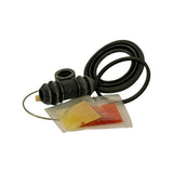 Alternative flat-lay showing large piston seal ring at top-right, bellows boot and spring wire left-centre, and the two grease pouches (amber and red-orange) laid out separately in foreground. Boot end-cap detail visible — small cream/tan plastic insert fitted to boot outlet. All rubber components appear supple with no visible cracking or perishing.