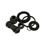 Alternative angle of full kit contents scattered on white background: two guide pin boots visible (one accordion-ribbed, one shorter), two flat ring-style dust seals and two O-rings of differing diameters, all black rubber. Confirms multi-piece minor seal kit.