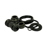 Third angle of the same loose rubber components showing kit depth and component profile. Both caliper pin boots show age-related surface chalking and minor stiffening consistent with long shelf storage. Seals and O-rings appear uninstalled and structurally intact.