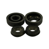 Three-quarter angle view of all four cups showing depth and profile: large cups have pronounced dome/hat shape with deep central bore, smaller cups have shallow flanged profile with wider flat base. Minor dust/shelf marks visible on rubber surfaces.
