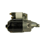 Starter motor, right-side profile showing solenoid on top and drive end nose pointing right. Opposite side from photo 2; shows second solenoid terminal stud and mounting bracket geometry clearly.