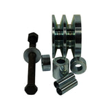 Kit contents from rear-facing angle showing pulley double-groove profile and flanged edges clearly; bolt, large flat washer, two tubular sleeve adapters, and two round spacers/washers arranged separately for clarity.