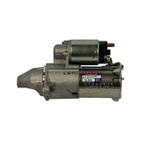 Direct right-side profile of starter motor. OEX identity label clearly legible: Brand New Unit, DX / DXS591 / DLBQ, Supplied by OEX Enduro, warranty void if label removed. Stamping on field housing reads 11 10 01 (date code).