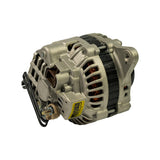 Rear three-quarter view showing rear housing, brush/regulator assembly with yellow specification sticker (text partially legible), B+ terminal stud with nut and wiring connector attached, and lower pivot mount ear.