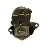 Rear/commutator-end view showing the circular brush-holder end cap secured with four cross-head screws, a separate mounting lug bracket with one bolt hole visible to the right, and the square-sectioned solenoid housing with yellow and brown wire connectors at bottom-left.