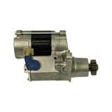 Left-side profile view showing the opposite solenoid face with blue rubber protective cap over one terminal, beige connector tab for ignition bypass wire, and the drive pinion extending to the right. Motor body wrap and top sticker (LRS1589) clearly visible.