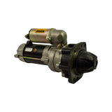 Three-quarter view from drive-end side with nose at right foreground. Flanged mounting face with four bolt holes clearly visible. Spec label readable on motor body. Solenoid assembly with WARNING label at top-left.