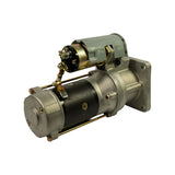 Three-quarter rear-right view showing solenoid terminal detail — main B+ stud, field terminal, and ground strap. Rear end cap and commutator access visible. Overall condition appears excellent and uninstalled.