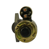 Starter motor removed from box, pinion/drive end view showing 25-tooth helical pinion gear and nose housing; metal finish consistent with new unused part.