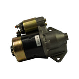 Commutator/brush end of starter motor showing rear housing and brush cap; no visible wear or corrosion.