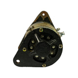 End-on view of commutator/rear end. Black cast-iron triangular mounting flange with three bolt holes. Central round housing with commutator brush access screws. Band clamp and field terminal connections visible at top edge.