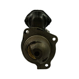 Drive-end face-on view showing SAE 3-hole mounting flange, cast iron drive-end housing, and circular bronze/brass bushing around drive shaft bore
