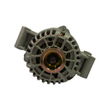Pulley-end face-on view. 6-groove poly-V gold-zinc pulley centred with overrunning alternator decoupler (OAD) hub visible. Open front casting with copper rotor windings visible around perimeter. Two outer mounting lug bores visible top and bottom.