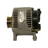Side view with DENSO label clearly legible: 63340005, 12 V, A127I-100, Made in UK, date code 46 06. Black plastic regulator/rectifier end cap visible at right with B+ terminal stud and slip ring brush terminals. 6-groove pulley at left. Purple marker on lower housing.