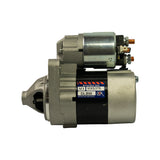 Rear-right 3/4 view of starter motor showing same OEX warranty label. Two copper solenoid terminals visible. Nose cone with pinion recess visible at left.