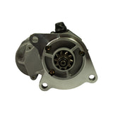 Drive-end face-on view showing 9-tooth pinion gear centred in machined nose cone bore; three-hole circular mounting flange with countersunk bolt holes; solenoid and wiring visible at top-rear