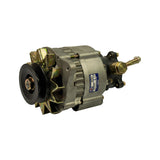 Right front three-quarter view of alternator removed from box. Blue OEX label with HXA055 and VBDB visible on stator housing. Black single V-groove pulley on drive end, zinc-plated twin mounting ears and fan. Black cast vacuum pump housing on slip-ring end with brass banjo/port fittings and oil supply/return barbs. Stamp '69/10' or similar visible on lower stator housing.