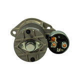 Rear/commutator-end and solenoid end detail: commutator end plate showing brush access ports and bearing housing; solenoid cap removed to reveal copper contact discs, plunger assembly, and coil winding connections.
