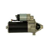 Opposite lateral view of complete unit showing motor can, solenoid body, and nose cone from pinion side with gear teeth visible protruding from cone.