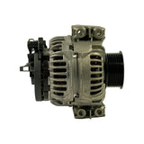 Slip-ring end (rear) view of alternator showing B+ terminal stud (M16 thread), multi-pin regulator connector plug, and cooling apertures in the rear housing.