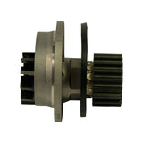 Side profile of the pump showing the flat aluminium mounting flange, cast body, impeller on the left and toothed timing-belt pulley on the right