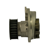 Side profile view showing the full depth of the pump body, timing-belt pulley on one side, and cast coolant outlet boss on the opposite side; weep hole visible mid-body.