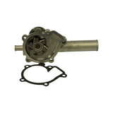Top-down overhead view of pump and gasket separated. Six-vane metal impeller clearly visible within the open impeller cavity. Integral bypass port stub exits lower-left of housing body. Six-hole paper gasket laid flat below pump.