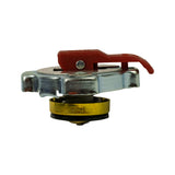 Side profile view of cap showing full assembly height. Chrome upper shell with red safety lever on top. Below, gold/brass-coloured sealing valve body with black rubber gasket visible at base. Spring mechanism partially visible between upper shell and valve body.