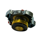 Underside angled view from opposite direction. Full bottom profile showing dual rubber seal discs, coil spring, brass valve body, and chrome lobed outer ring. Condition appears unused.