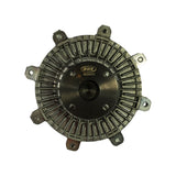 Top face of fan clutch showing NUK oval logo and stamped part number MD050472 on the black-finished central hub plate. Five fan mounting tabs and full radiating fin detail visible around the perimeter.