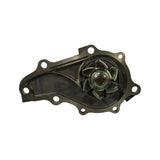 Pump body top-down view showing impeller face with five curved vanes, seven-bolt mounting flange perimeter, and off-centre coolant passage.