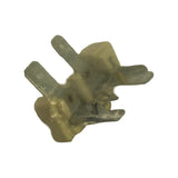 Close-up of the part removed from packaging, translucent amber plastic body with two exposed male spade terminals and internal metal contact strips visible through the housing