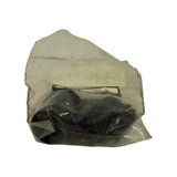 Top-down view of the bag laid flat showing the full loom curled inside, black connector housings and short coloured pigtail wires visible through the clear plastic.